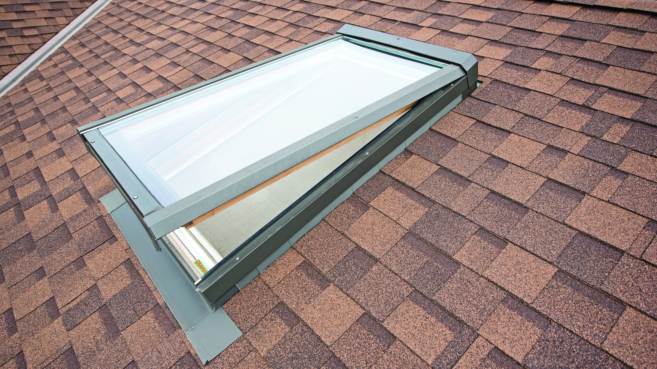 Rain sensing skylight