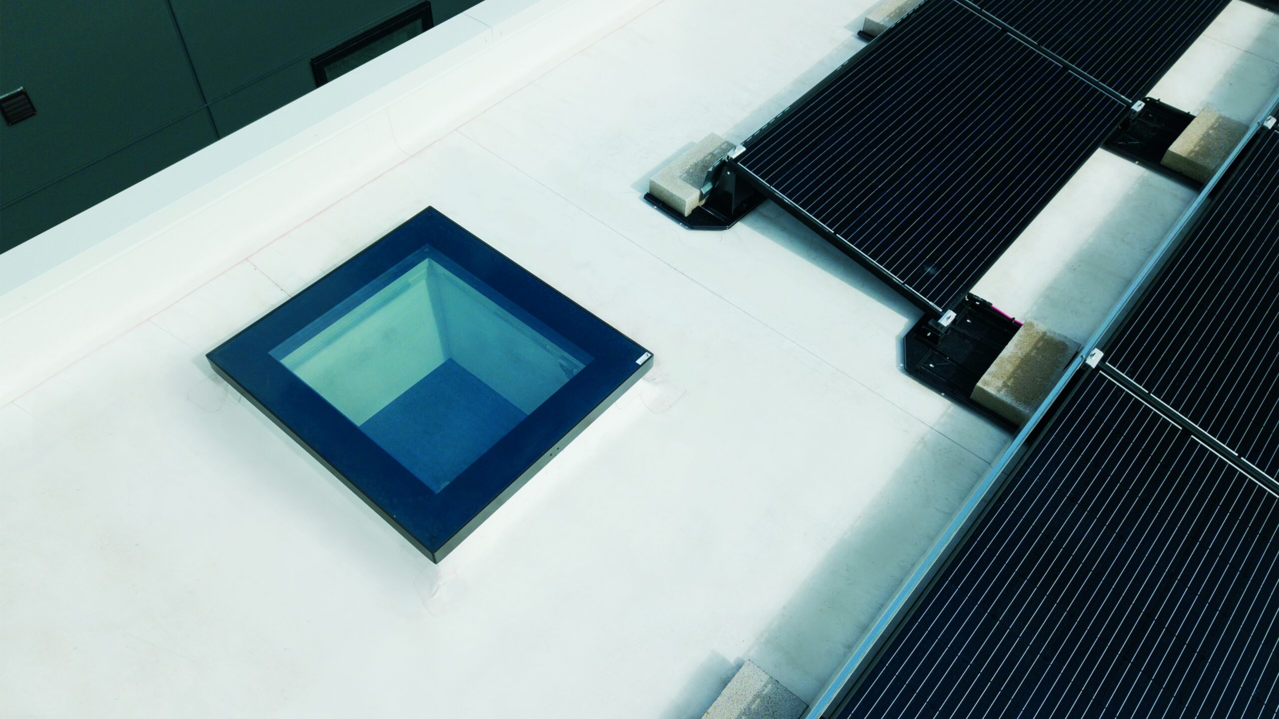 Drf Flat Roof Access Skylight Solar Panels Hero