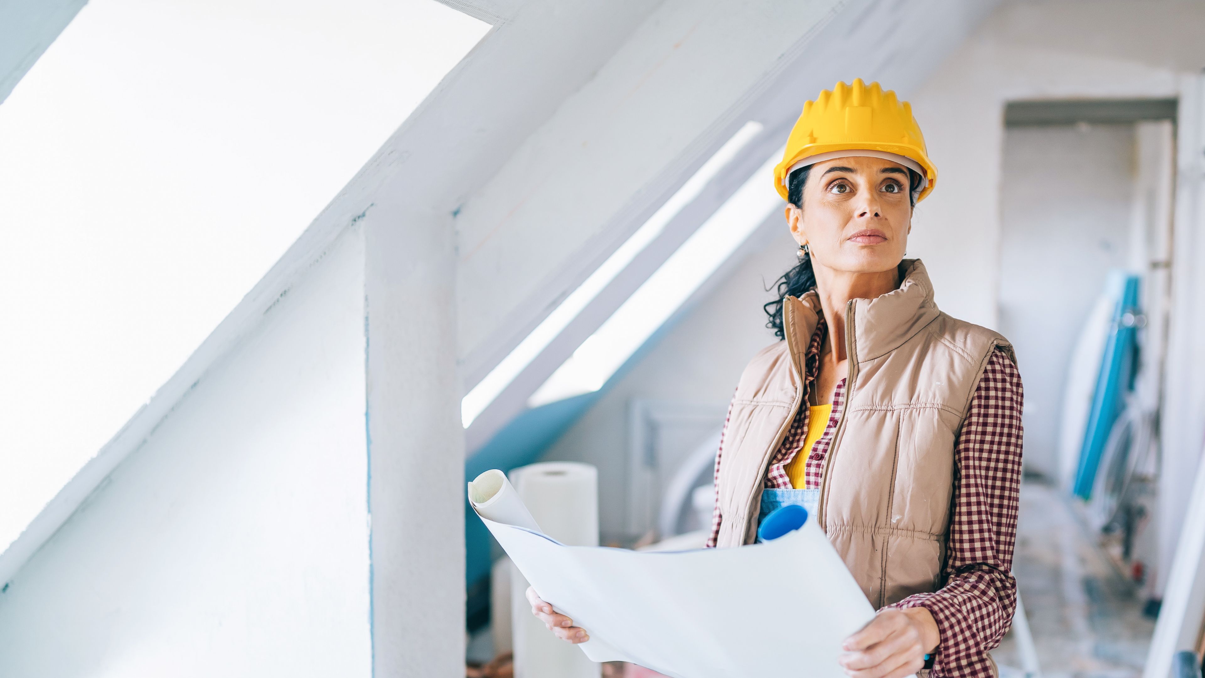 Architect in yellow hard hat hero