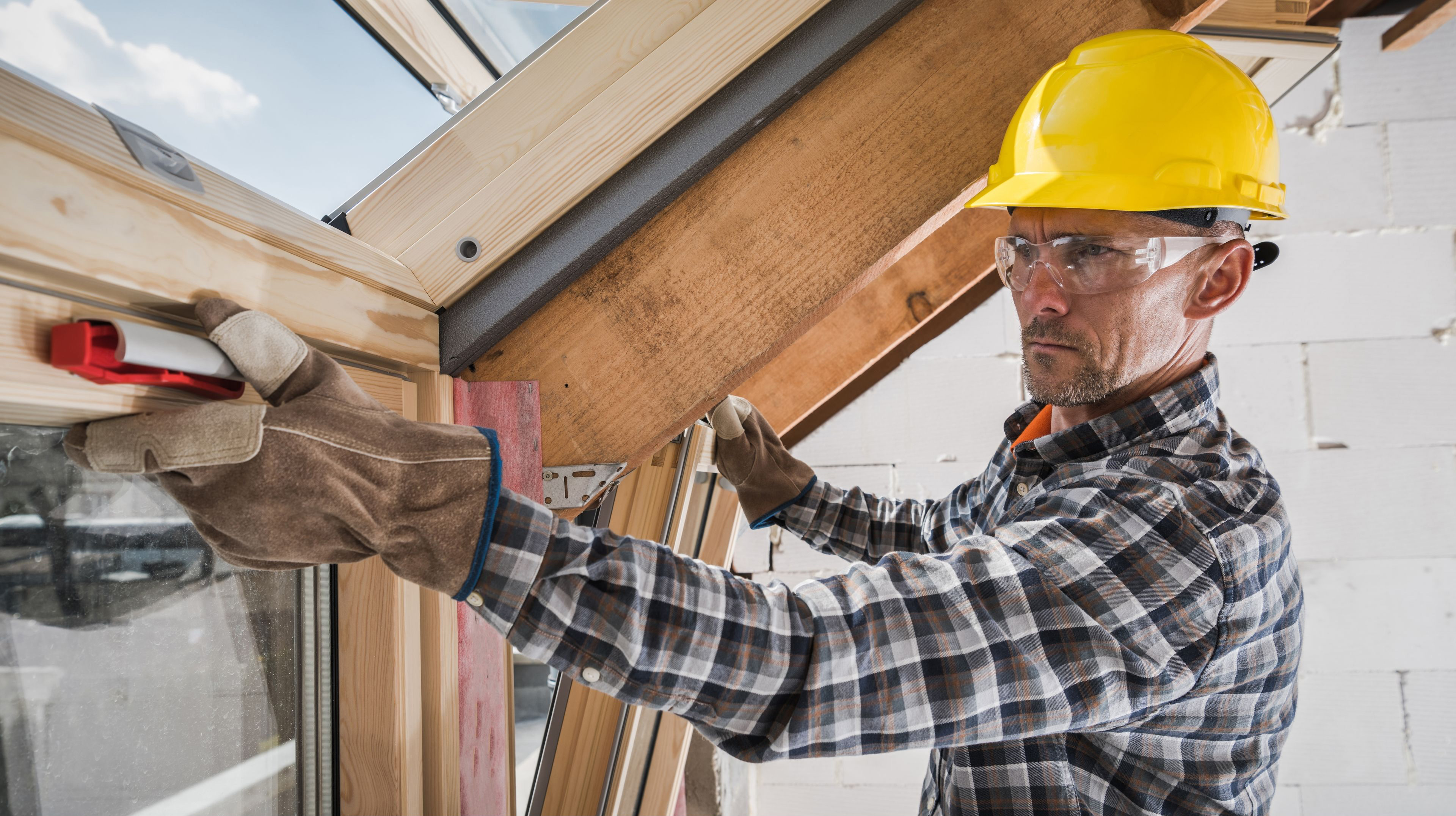 Contractor Installing Roof Window